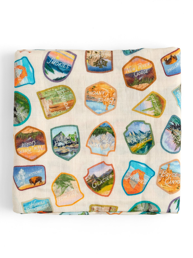 National Park Badges Muslin Baby Swaddle Blanket, 1 of 2